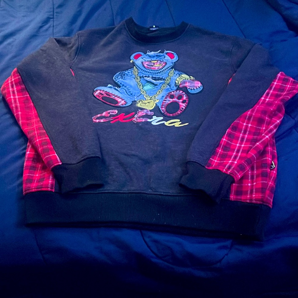 A teddy bear sweater